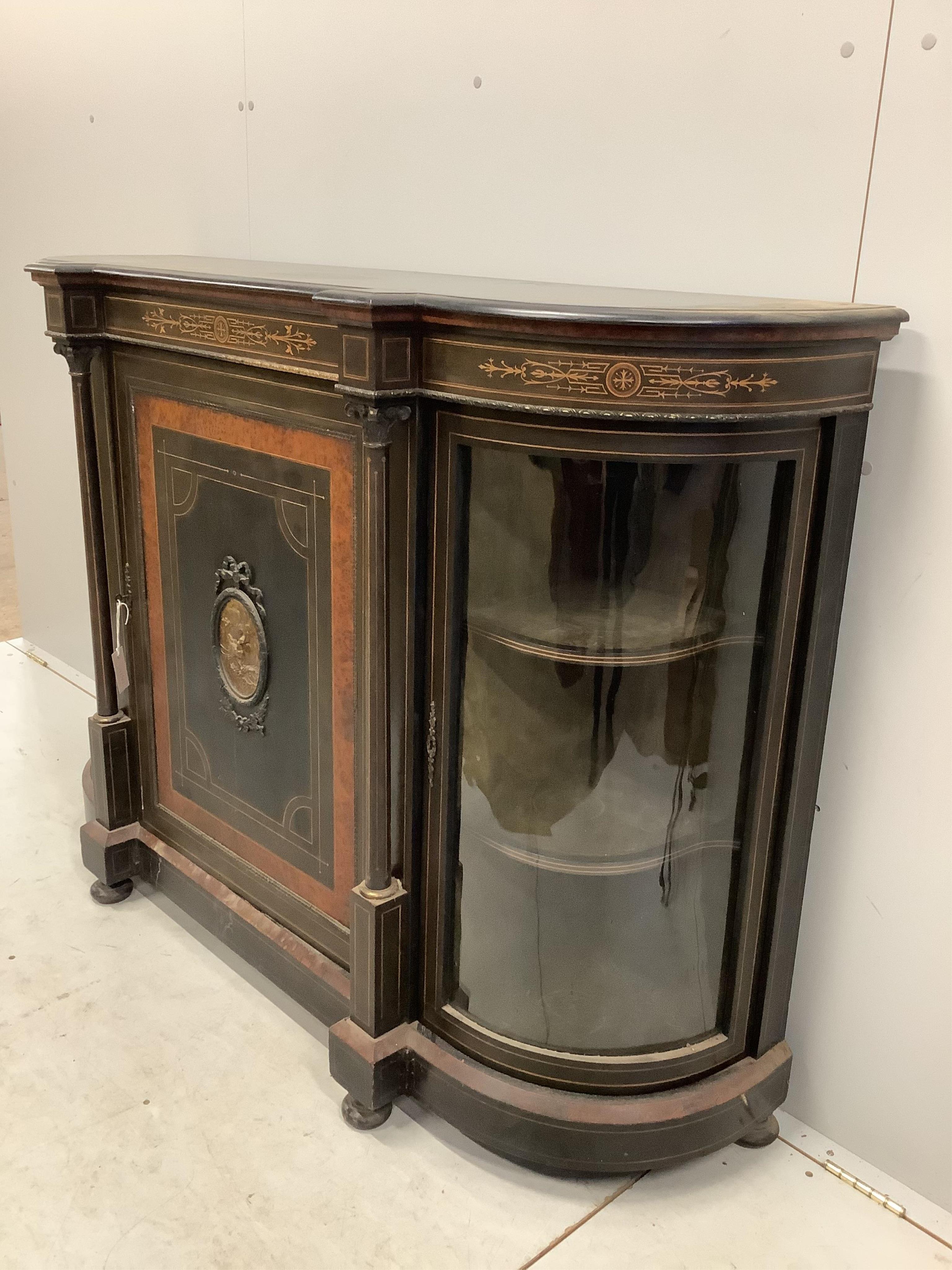 A late Victorian gilt metal mounted amboyna banded ebonised credenza, width 150cm, depth 44cm, height 106cm. Condition - poor